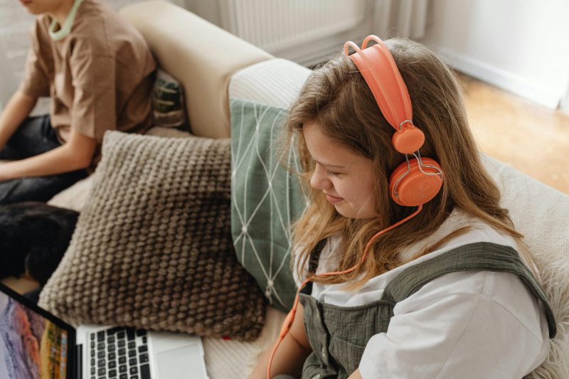 Teenager wearing headphones to manage sensory overload during Autism assessment